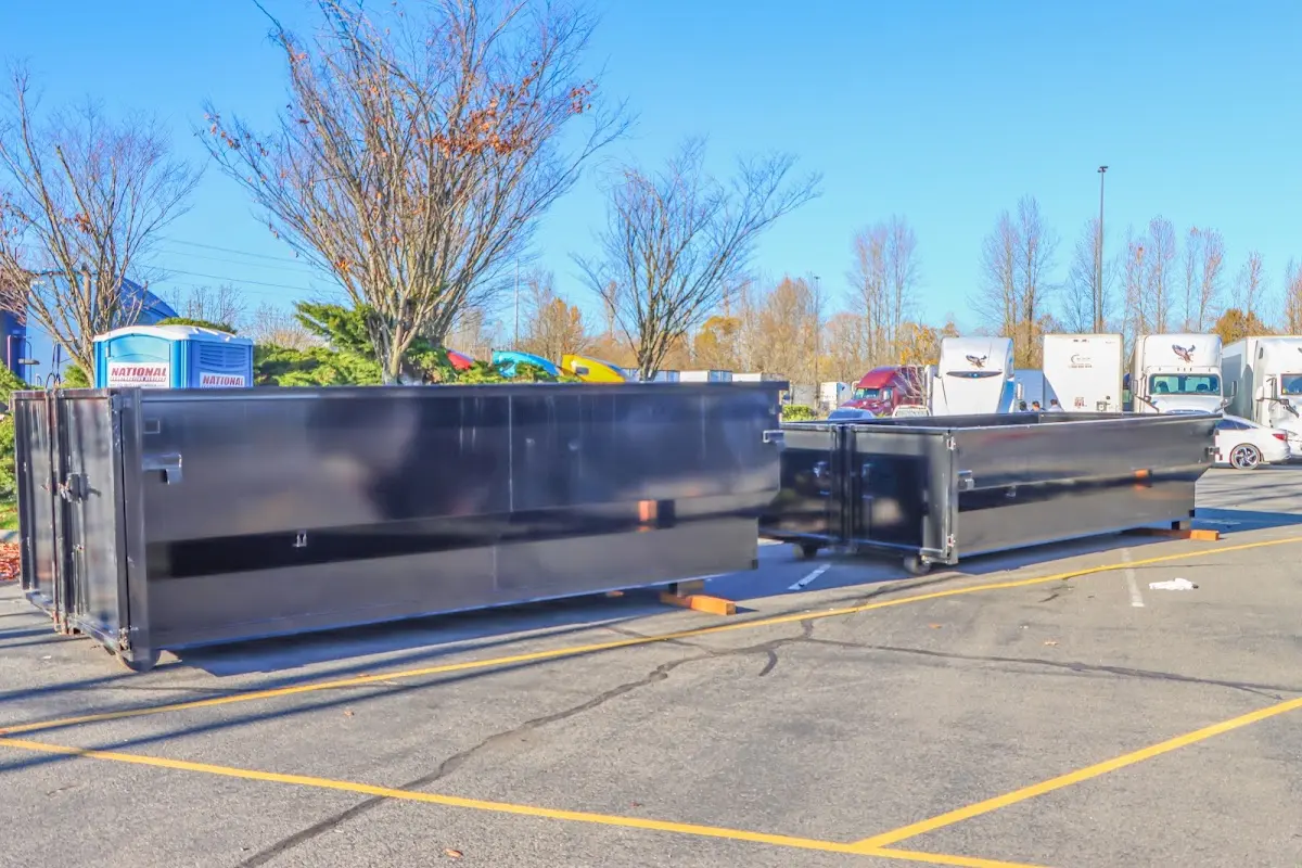 Professional dumpster rental service with roll-off container on residential driveway in Mission Viejo